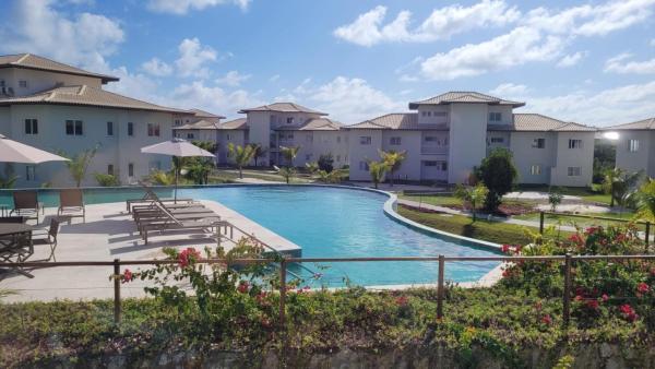 Apartamento no Village dos Ipês em Praia do Forte, Reserva ahora  Hoteles con piscina en Noreste de Brasil, Piscina
