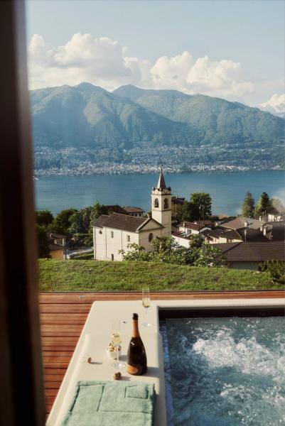 Habitat Lago Maggiore, Reserva ahora  Hoteles en Tesino con aparcamiento, Aparcamiento