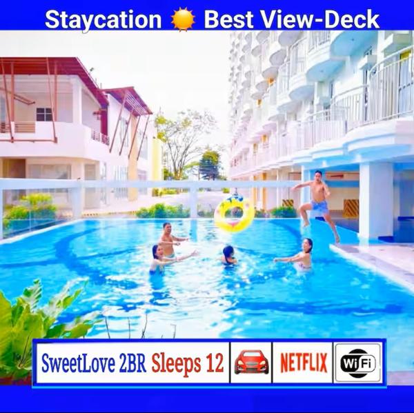 SweetLove Hideaway CITYLAND Condo 2-BR, 2-Bath, Living room, Sleeps 12, Kitchen, Free Pool, Wi-Fi, 2 Parking, View-Deck on 24F rooftop, Prenota  Iruhin Luzon