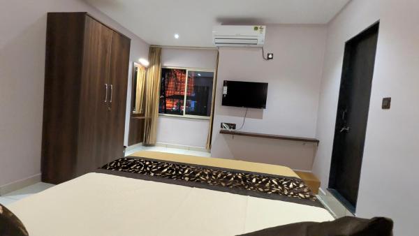 Amrut Inn, Réserver  Māvalli Zone sud